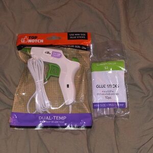 Brand new hot glue gun with glue sticks!